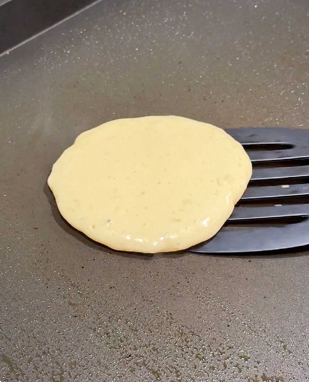 flipping pancake with spatula.