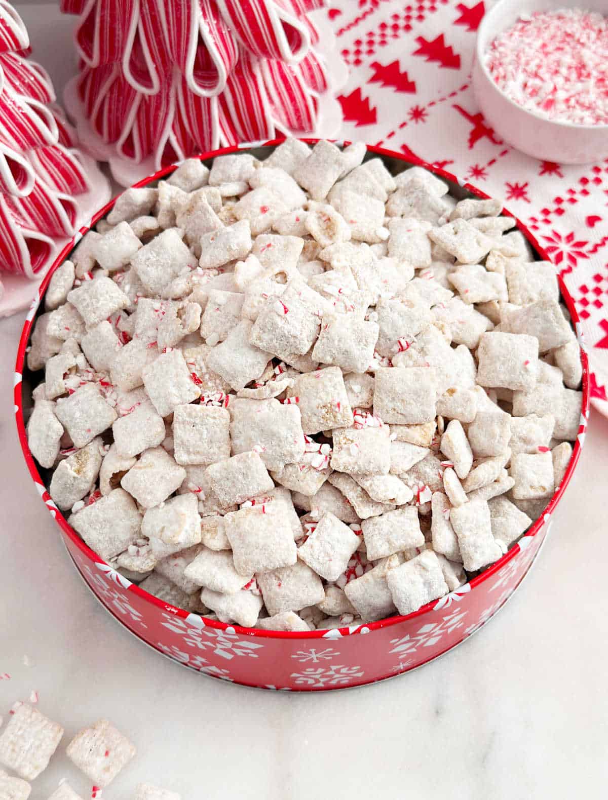 peppermint puppy chow in red holiday tin.