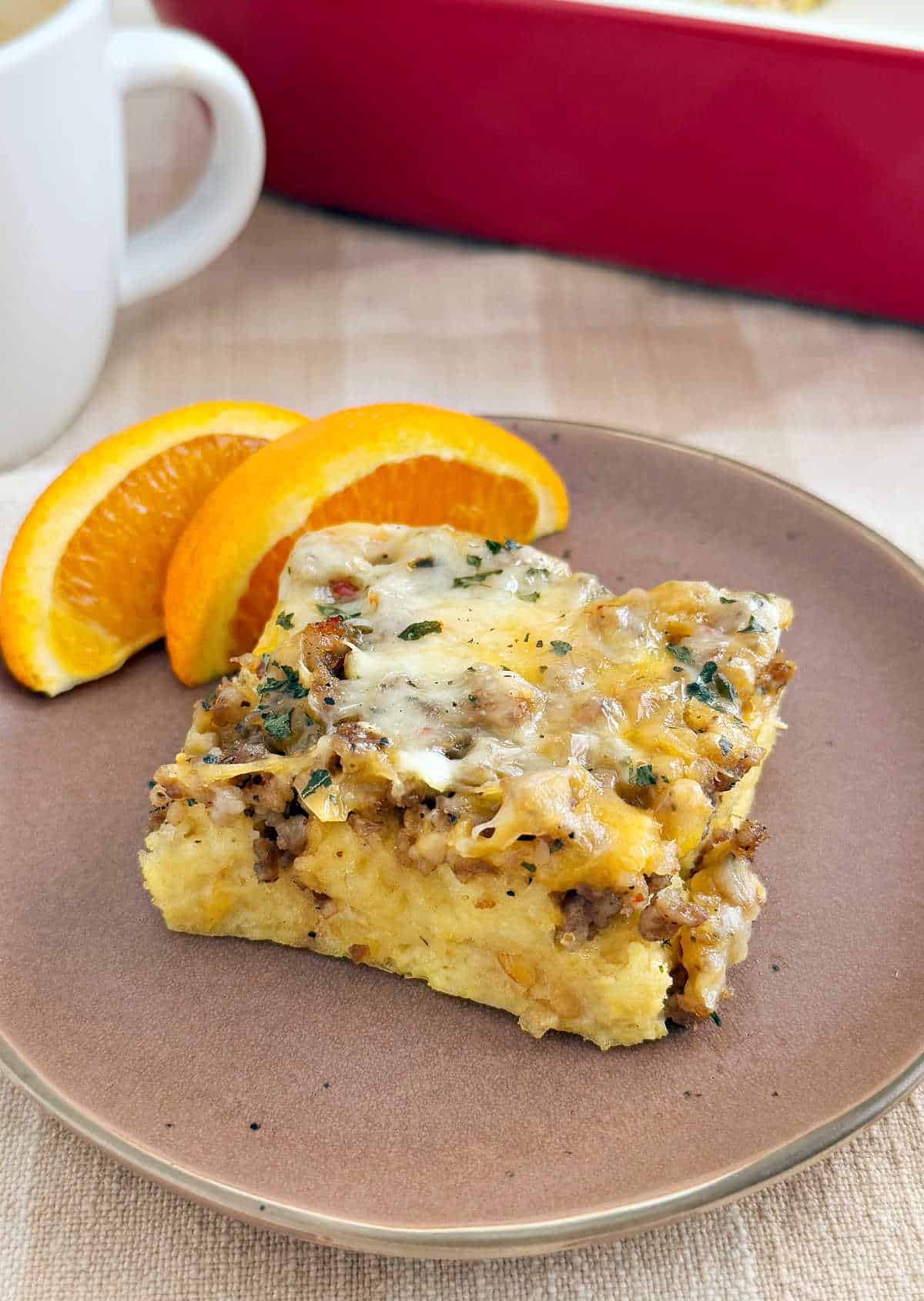 slice of sausage egg breakfast casserole on a plate.