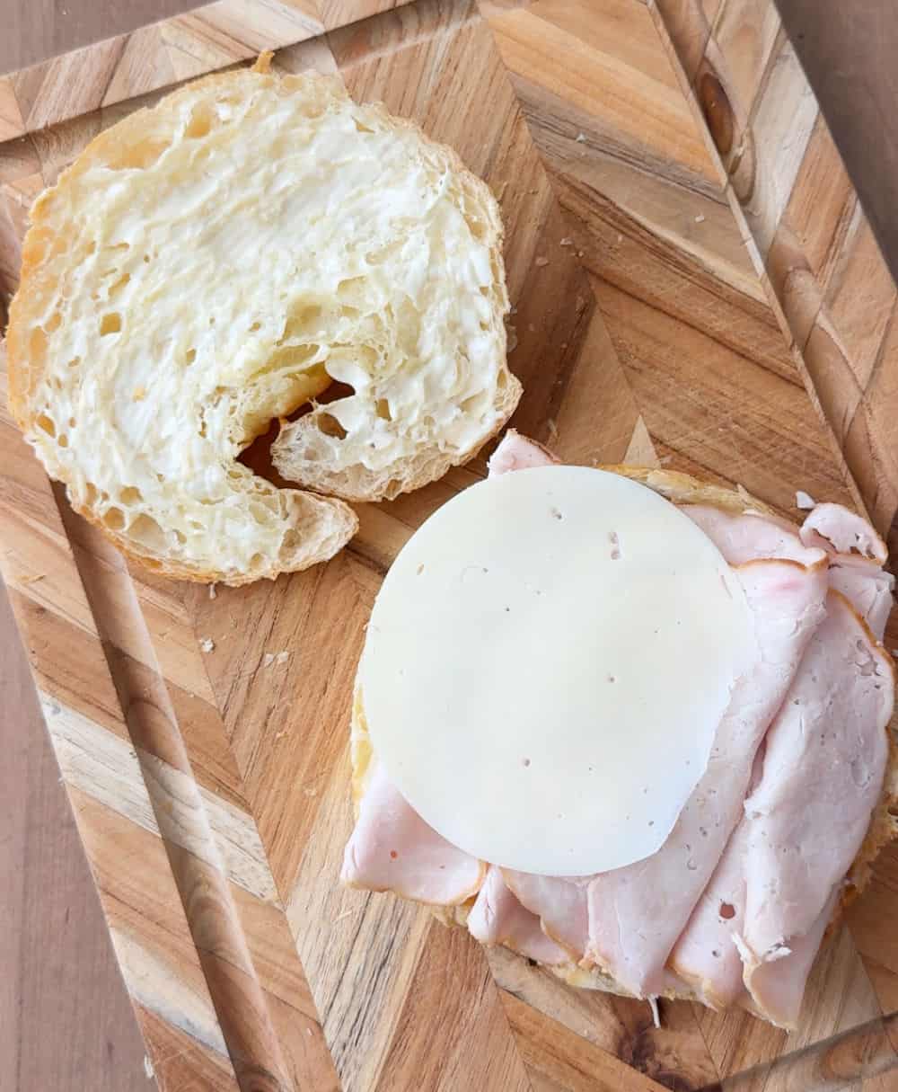 adding turkey and cheese.