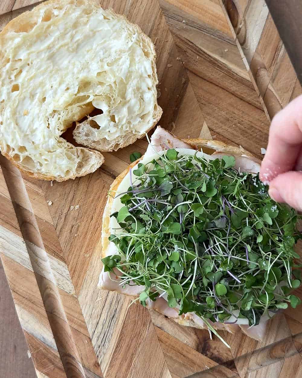 adding salt and micro greens.