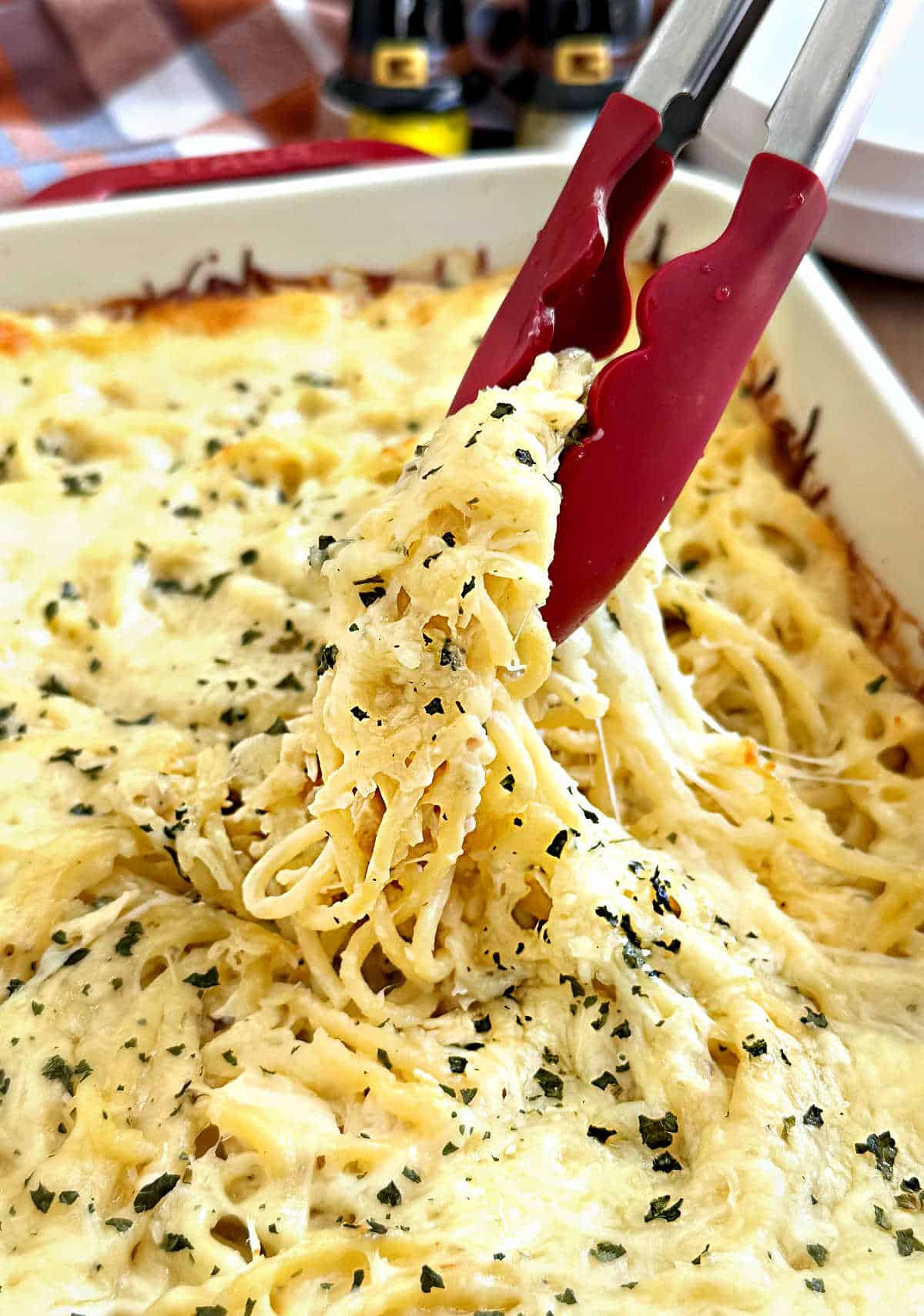 kitchen tongs serving turkey tetrazzini.