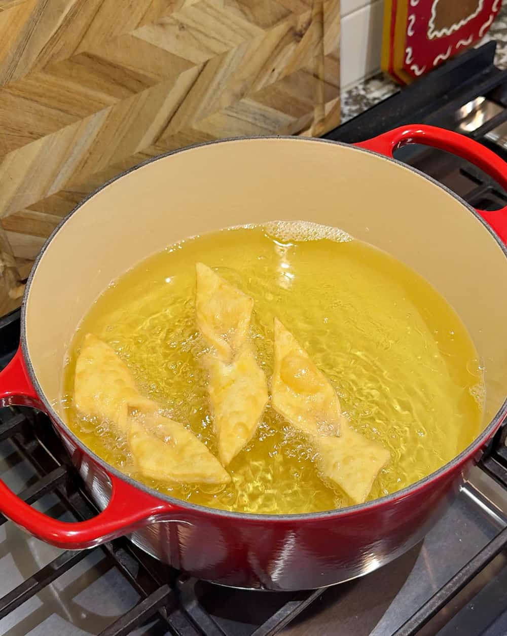 frying angel wings in oil.