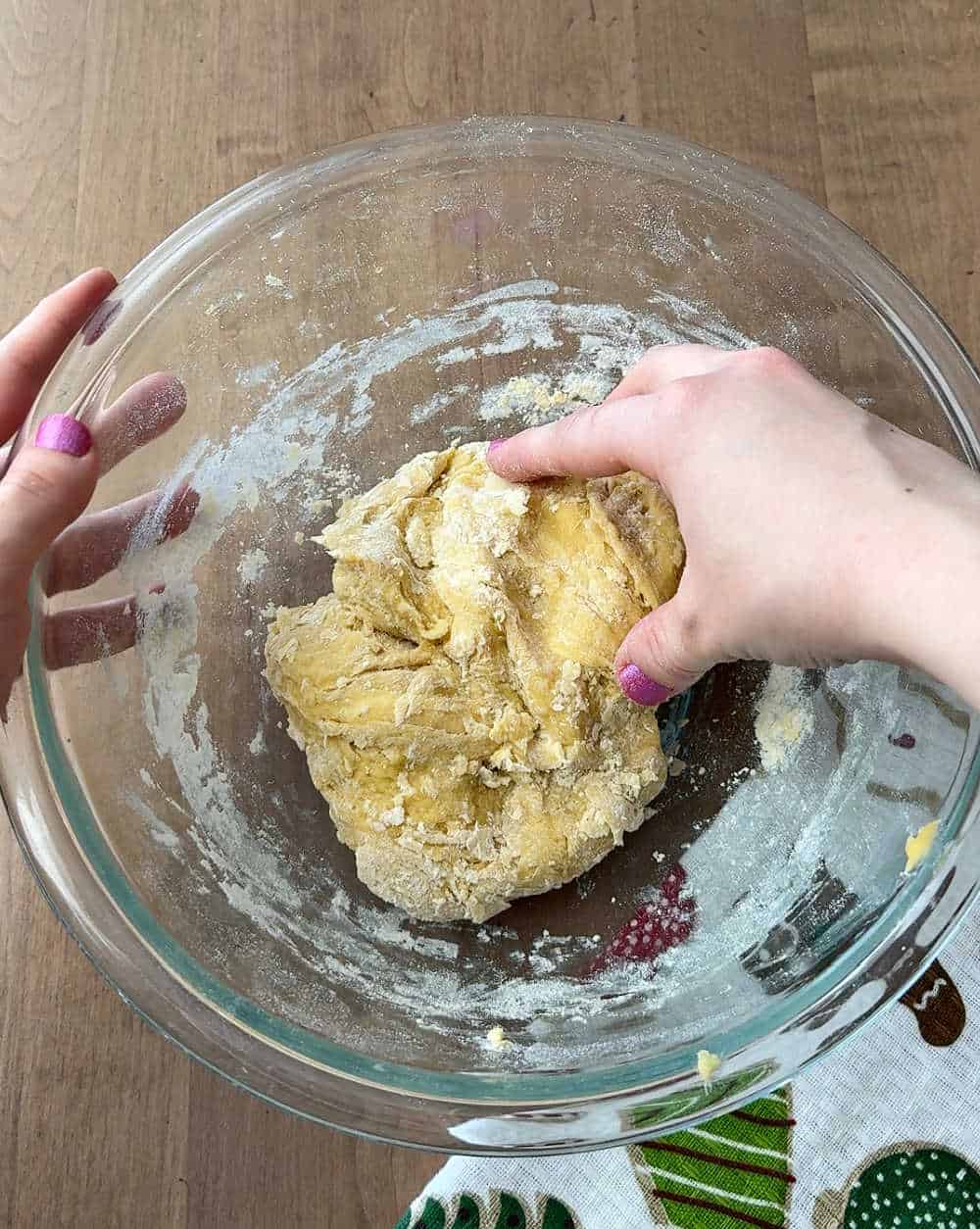 mixing dough with hands.