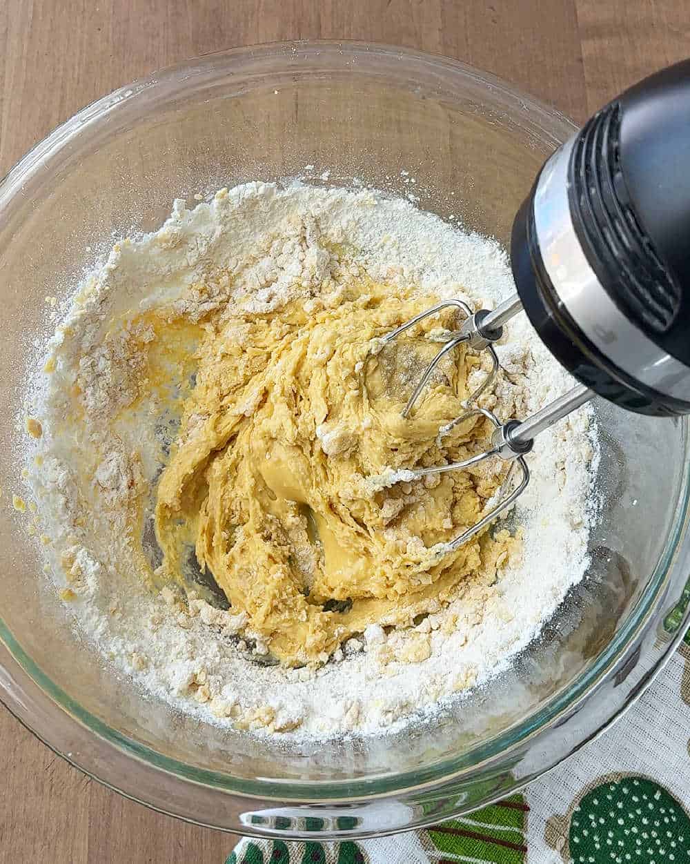 mixing dough with electric mixer.