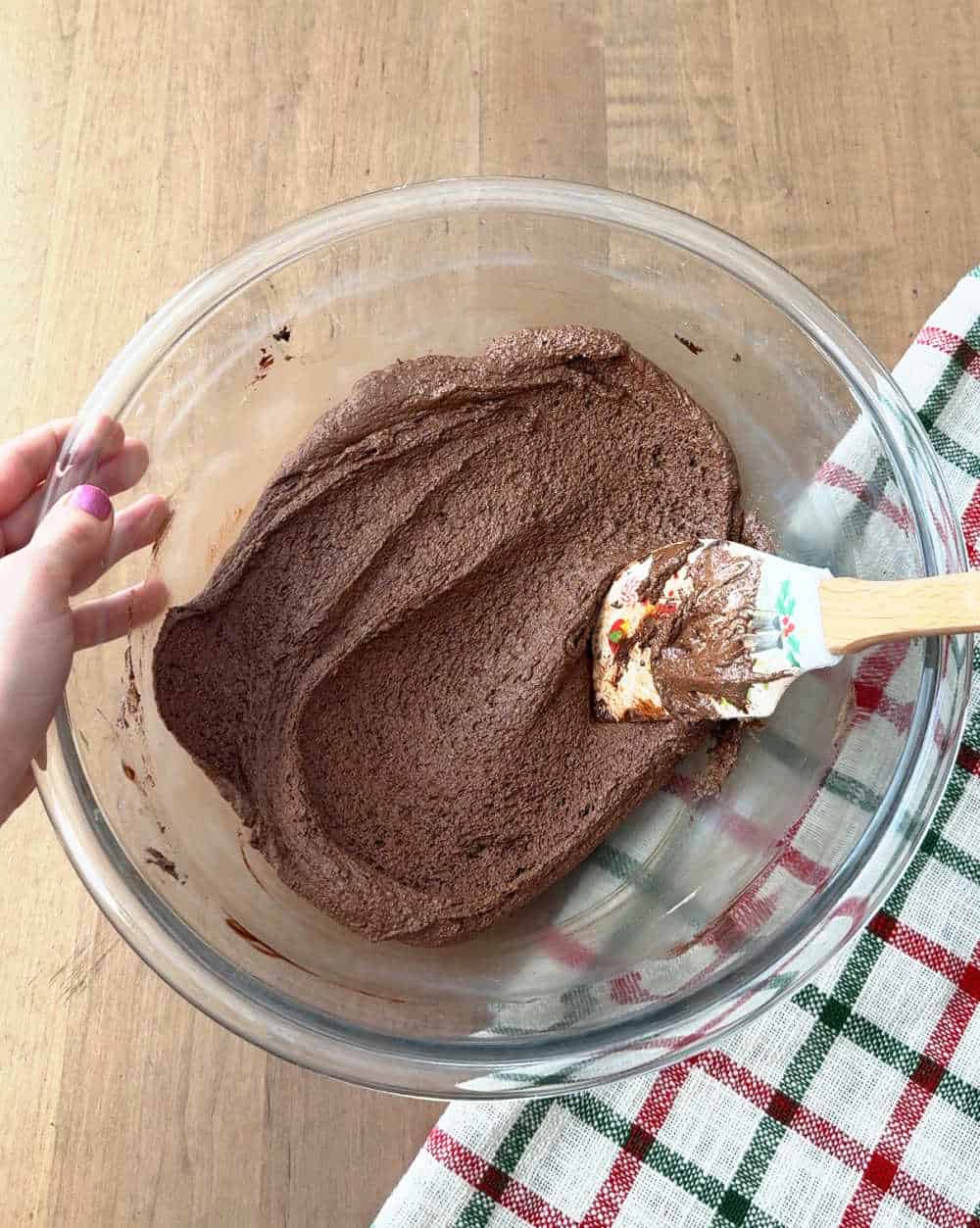mixing melted chocolate, cocoa, fluff and butter in bowl.