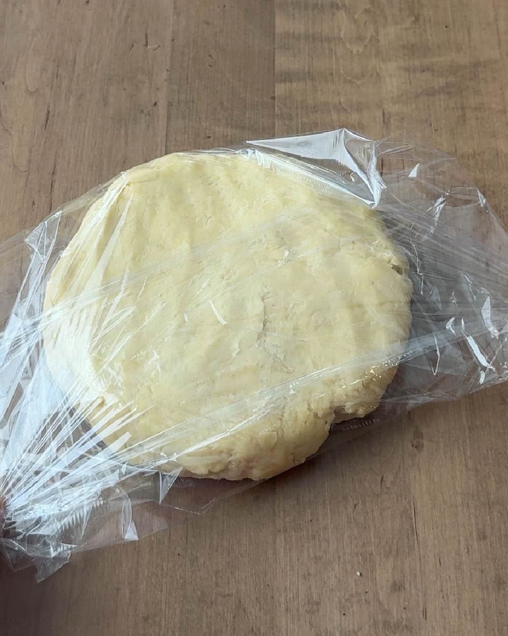 wrapping cookie dough in plastic wrap.