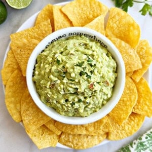 bowl of avocado cottage cheese dip with tortilla chips.