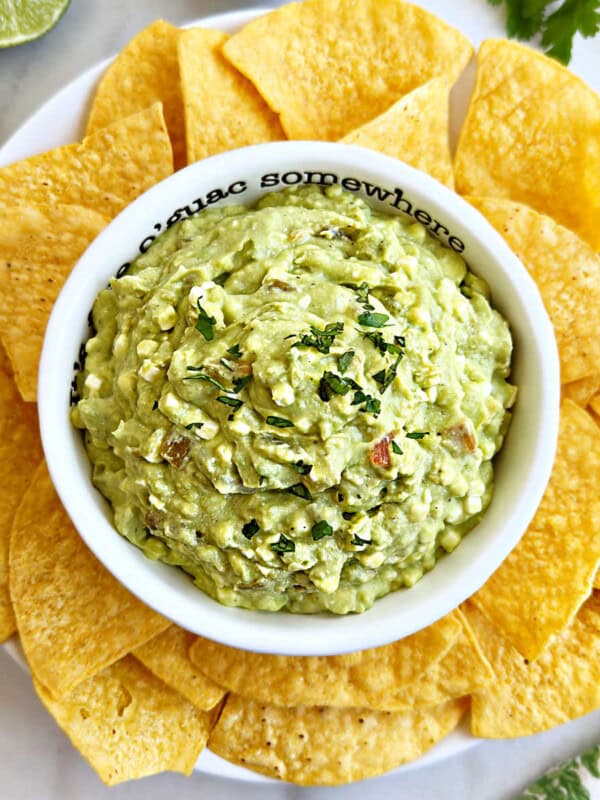 bowl of avocado cottage cheese dip with tortilla chips.