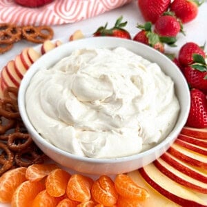 cool whip fruit dip with fresh fruit and pretzels.