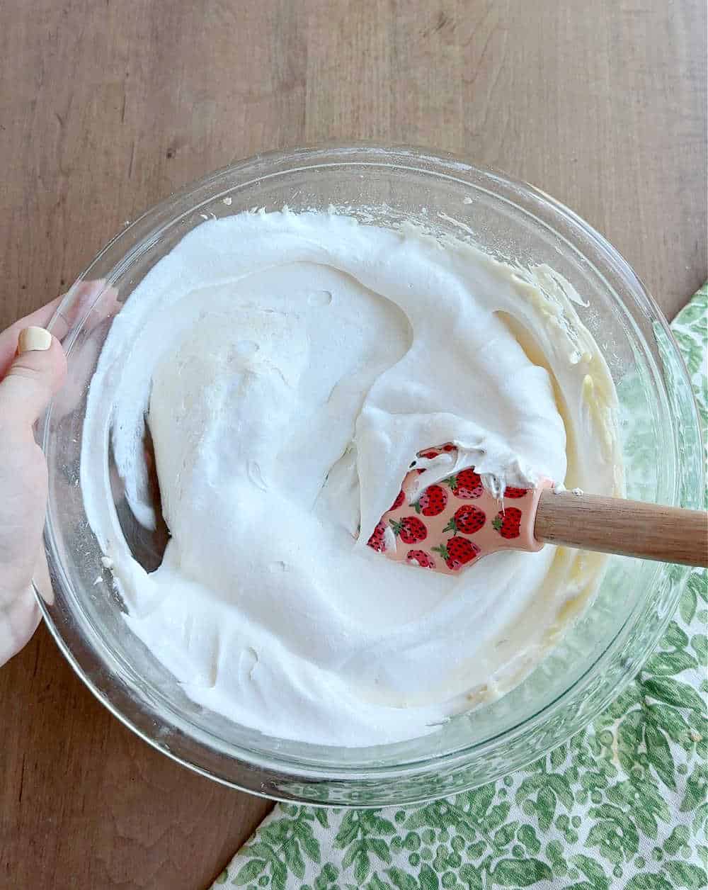 folding in whipped topping with spatula.