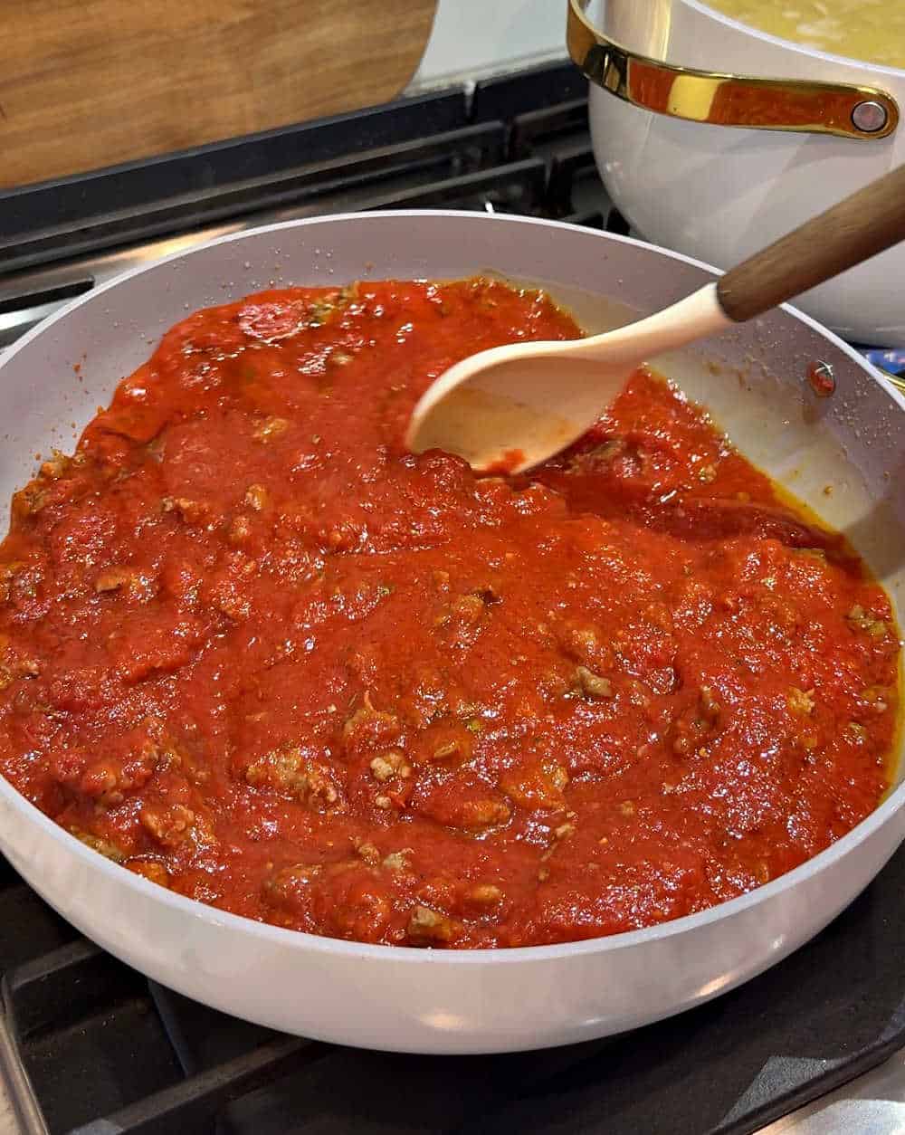 stirring vodka sauce