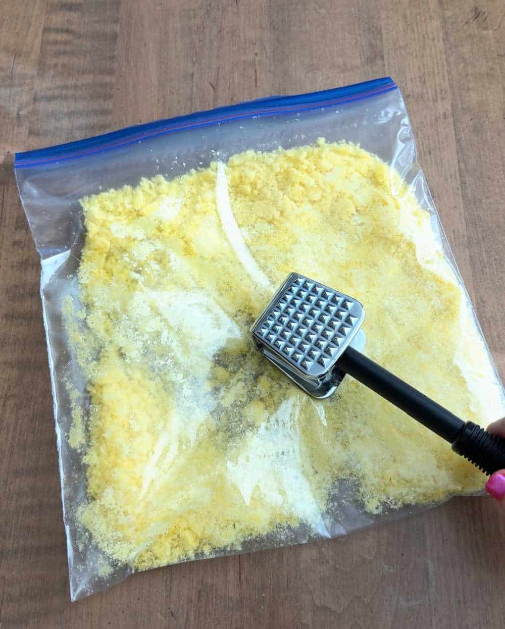 crushing cheetos with mallet.