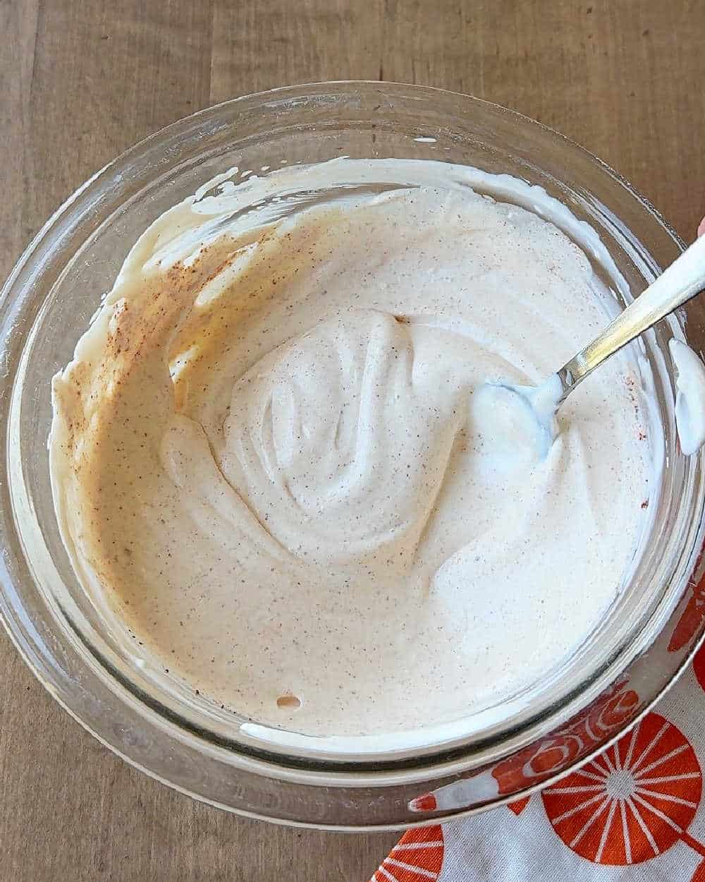 stirring dip in bowl.