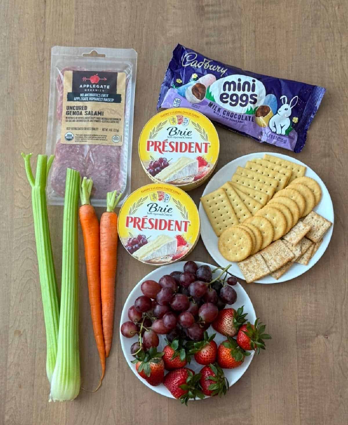 salami, brie wheels, candy, crackers, fruit, veggies