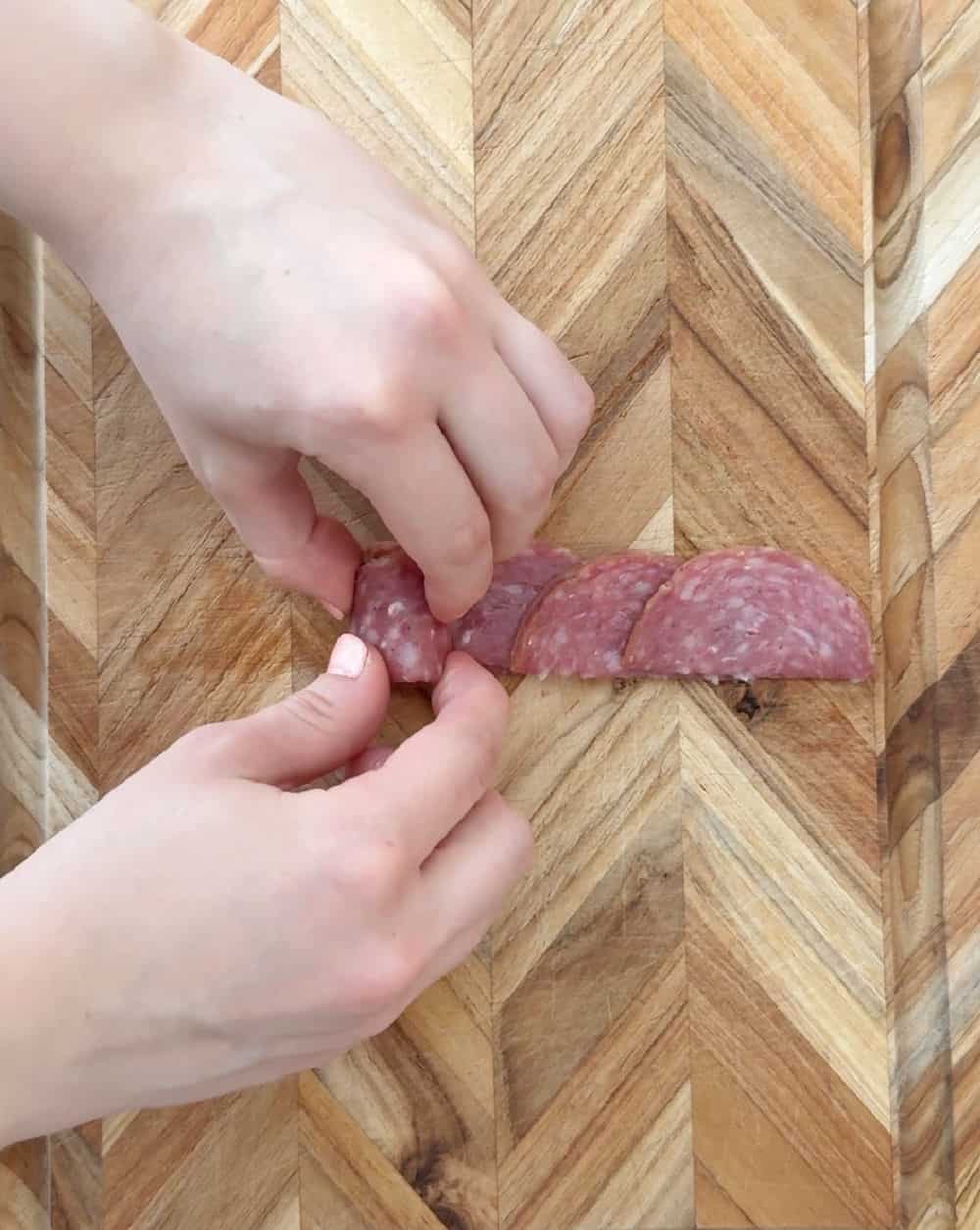 rolling up salami.