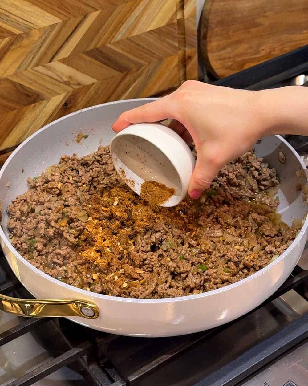 adding homemade seasoning.