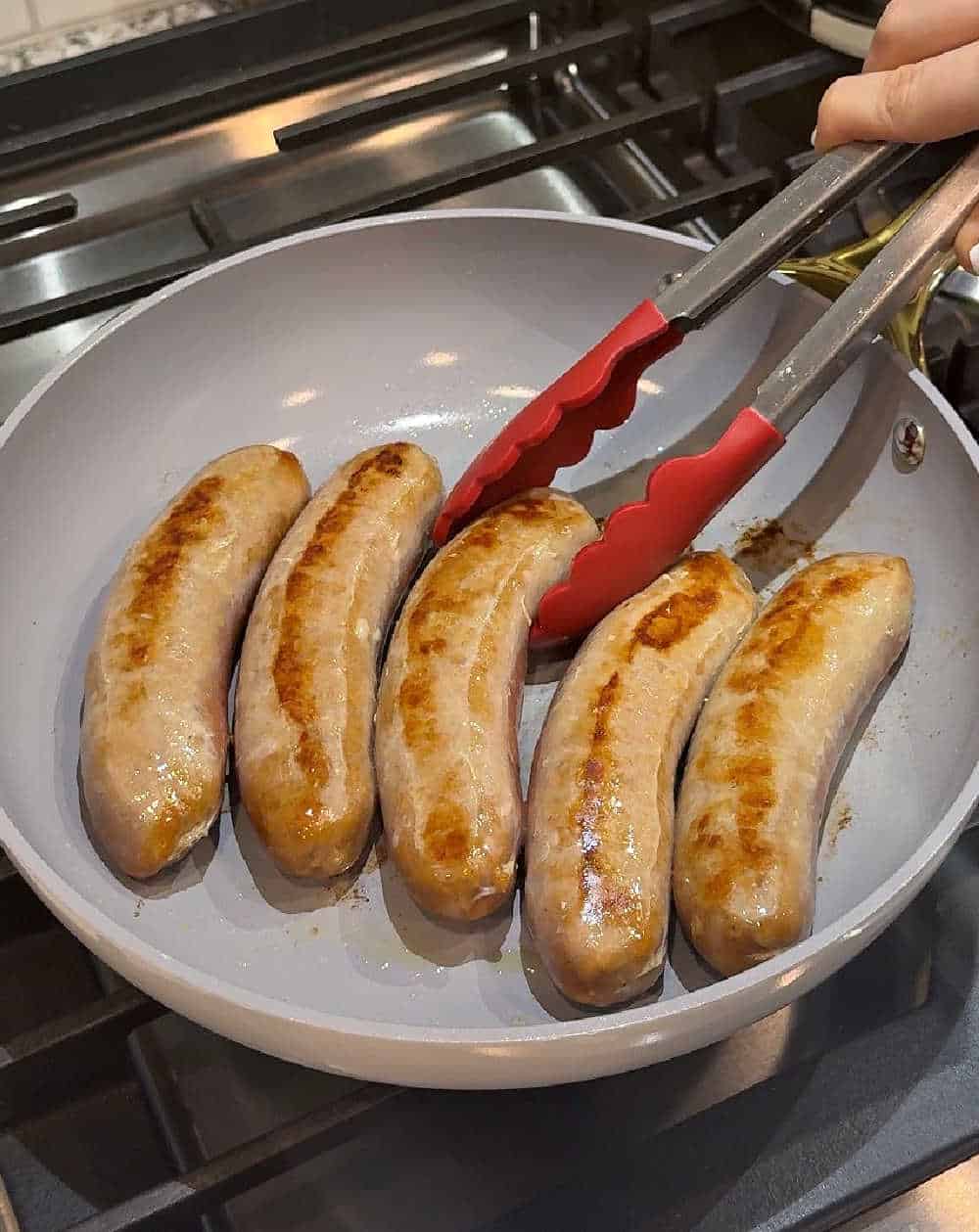 browning sausage links in skillet.