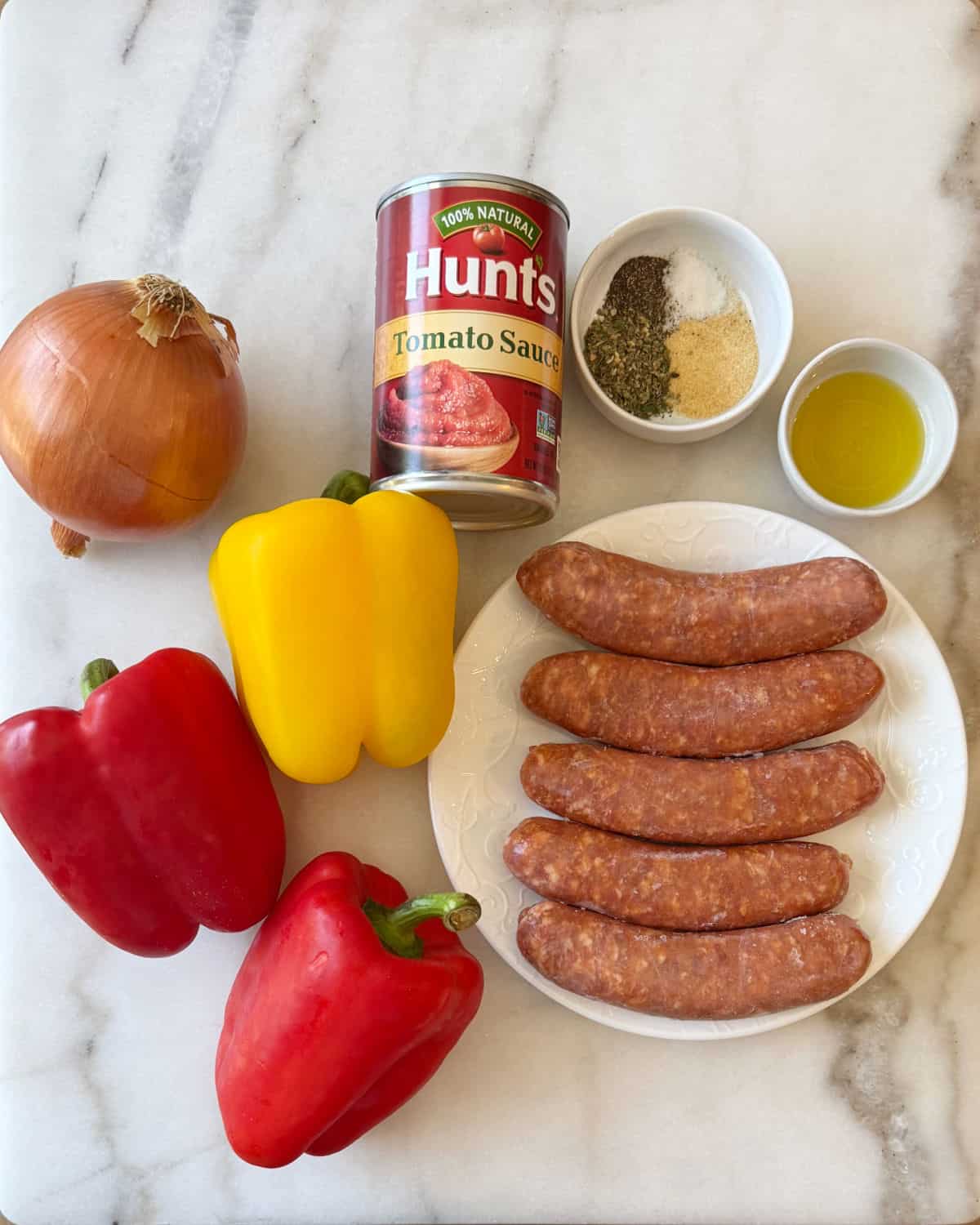 hot Italian sausages, bell peppers, oil, spices, onion and tomato sauce.