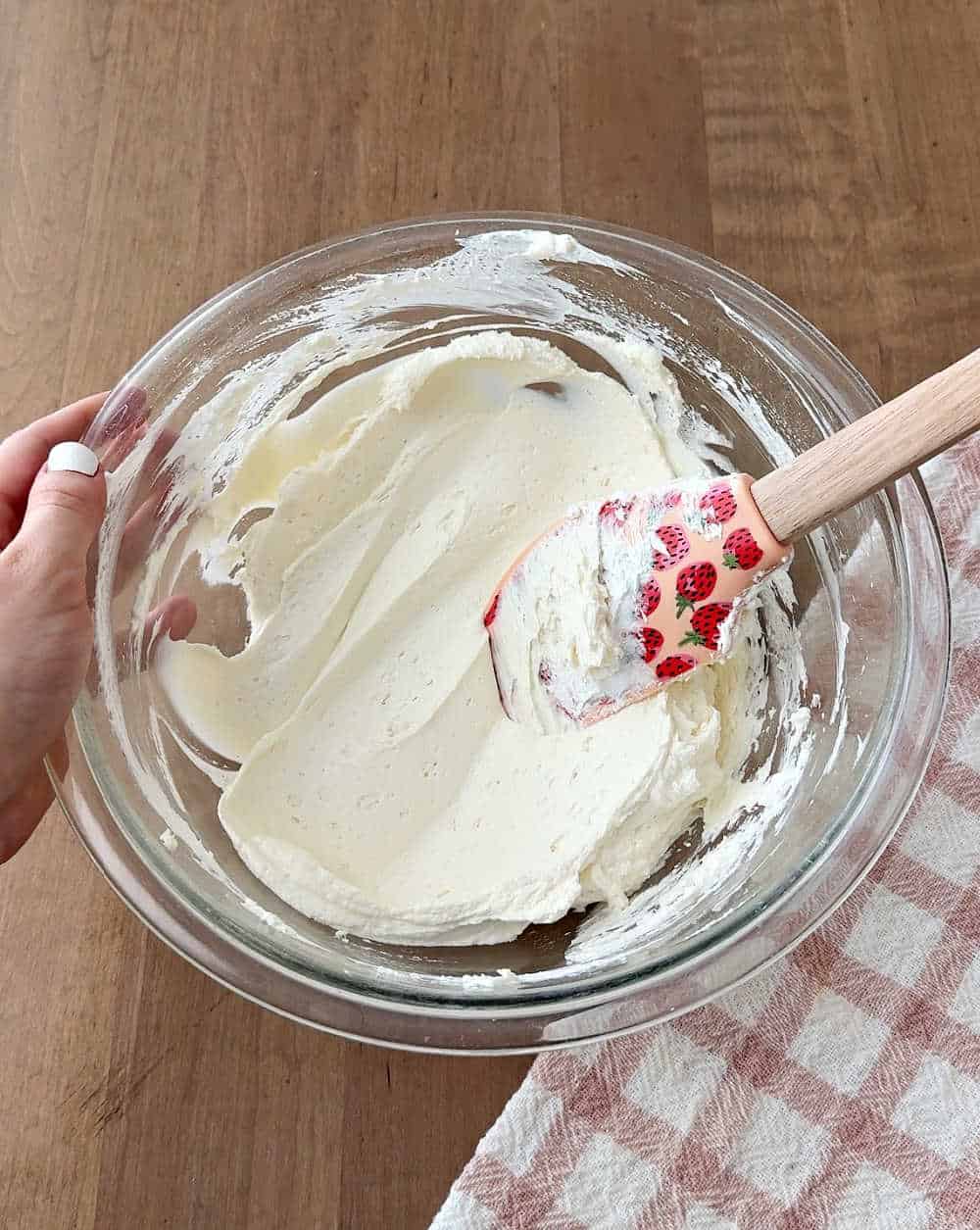 folding in whipped topping with spatula.