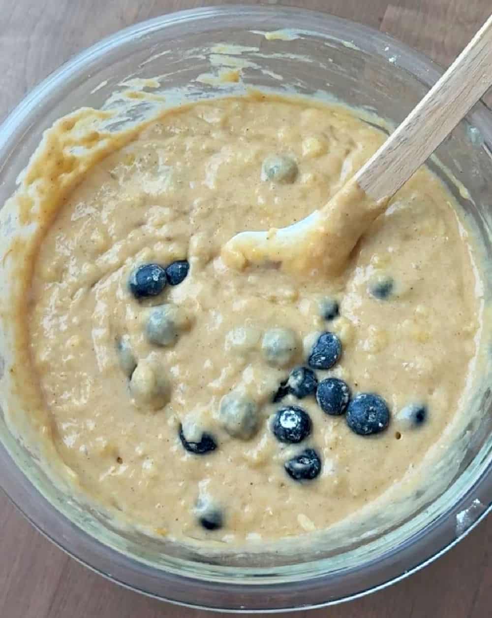 stirring berries into batter.