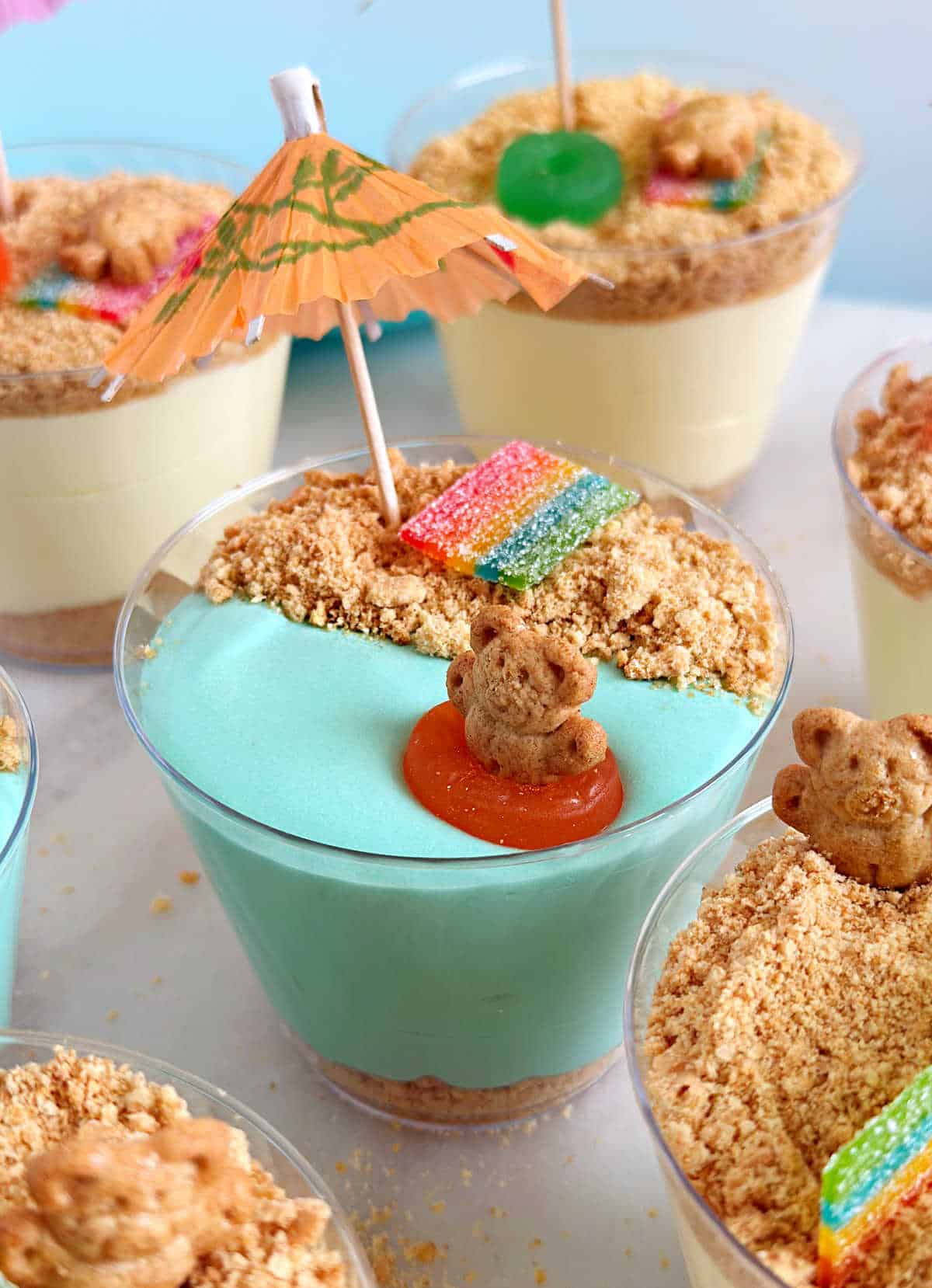 teddy graham bear in life saver float in blue pudding cup.