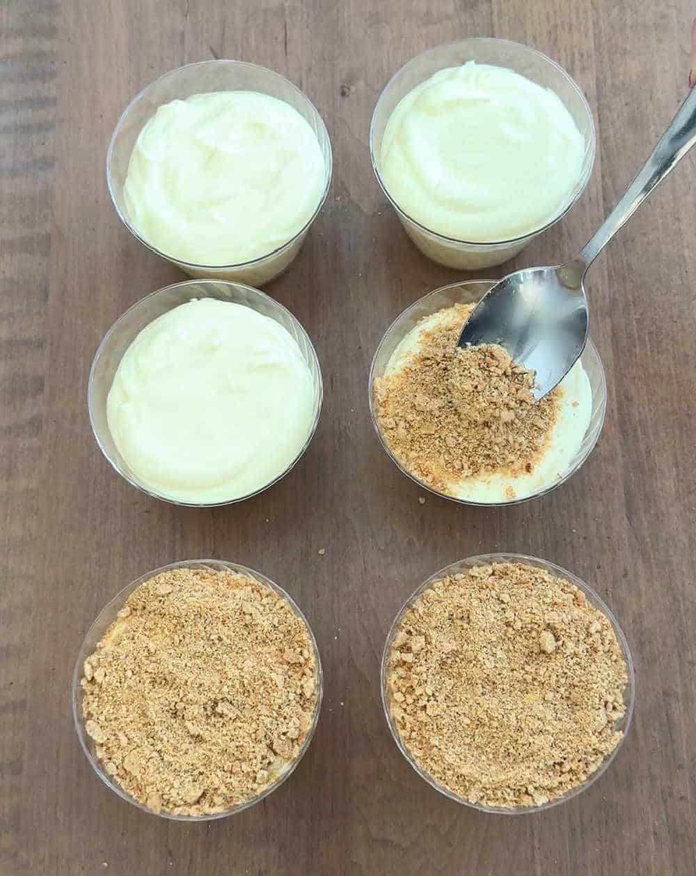 topping cups with sand cracker layer.