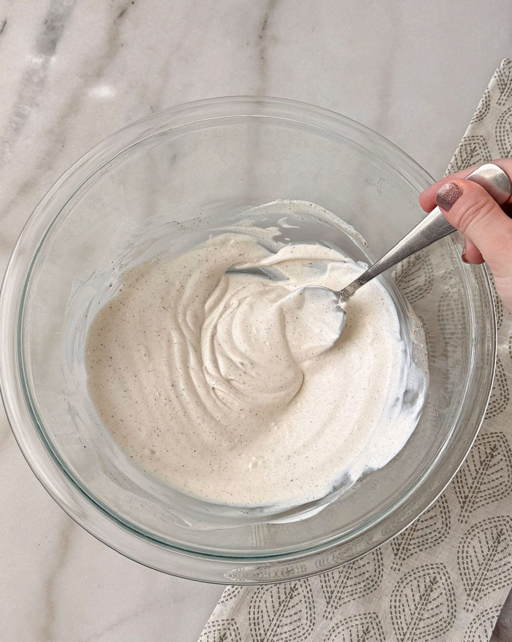 mixing dressing with spoon.