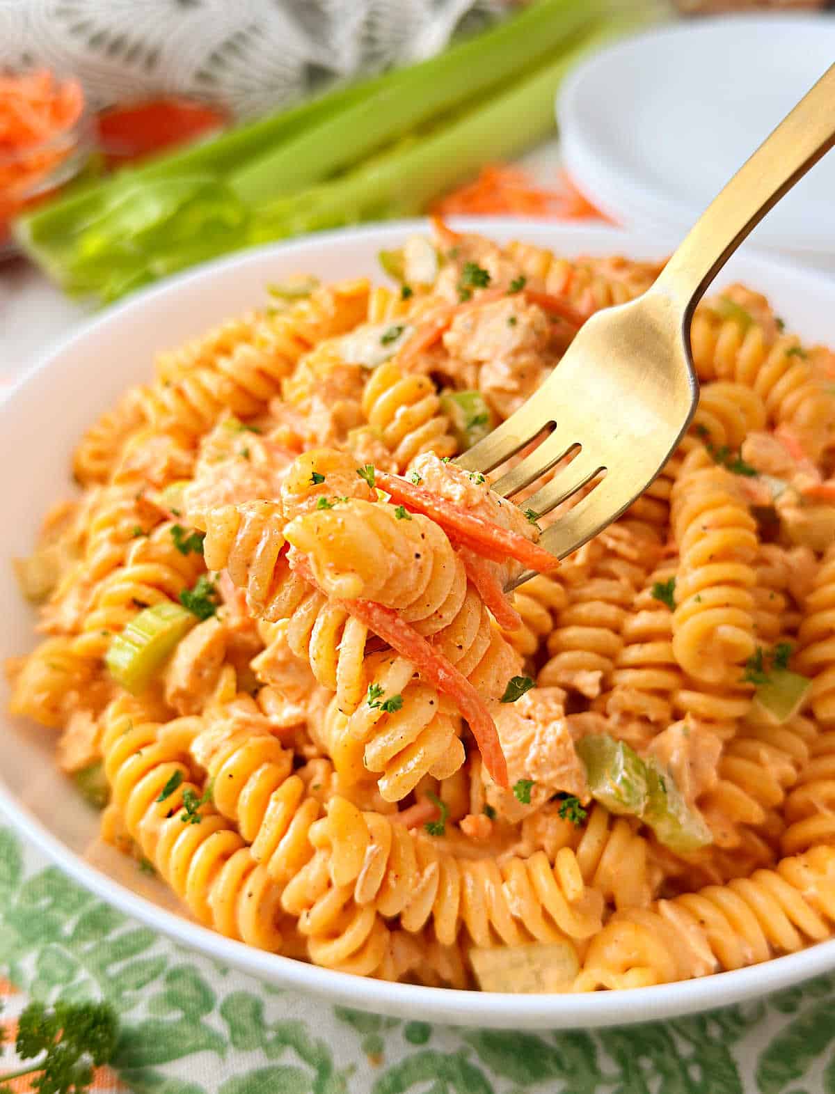buffalo chicken pasta salad on a fork.