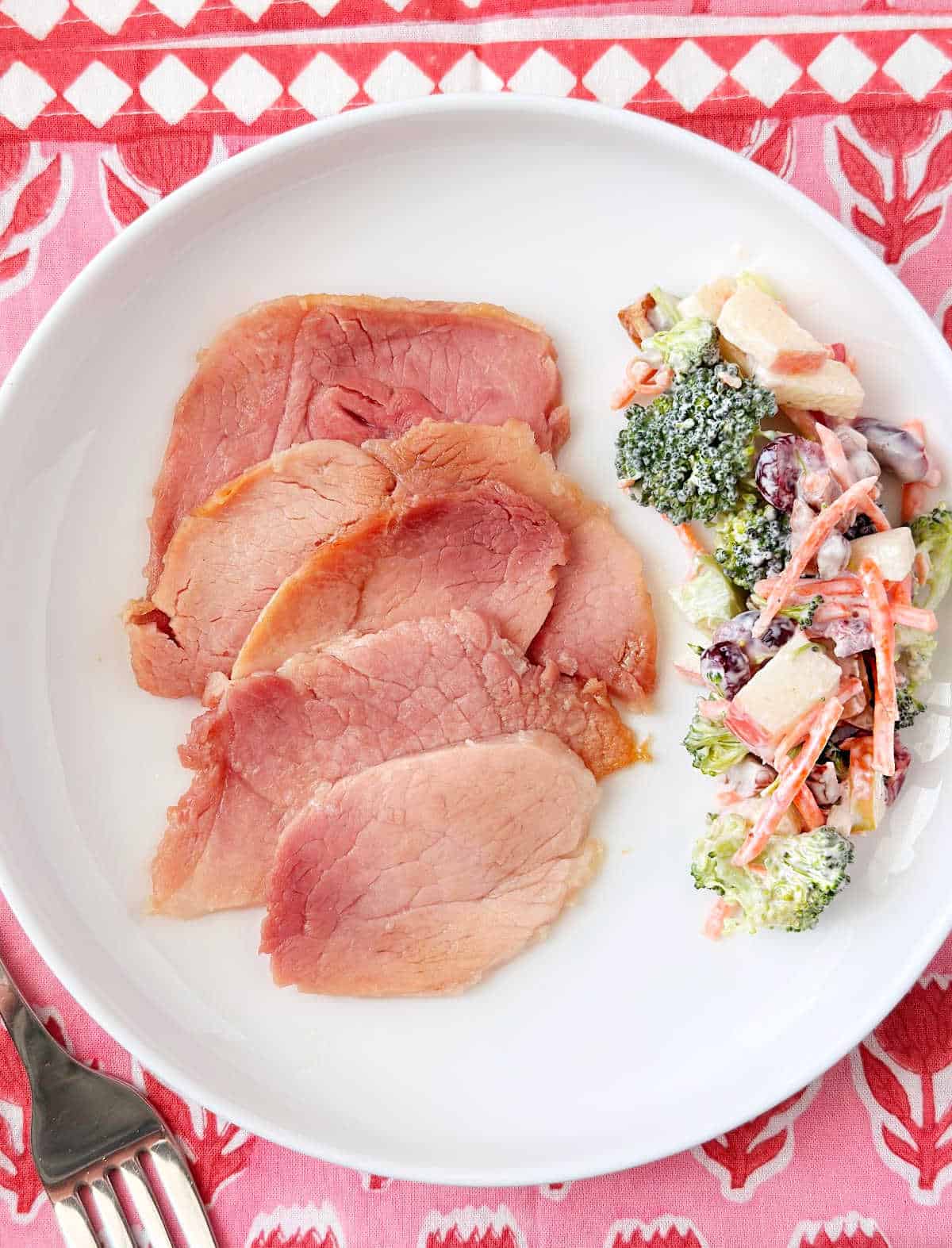 brown sugar ham with broccoli salad on a plage.