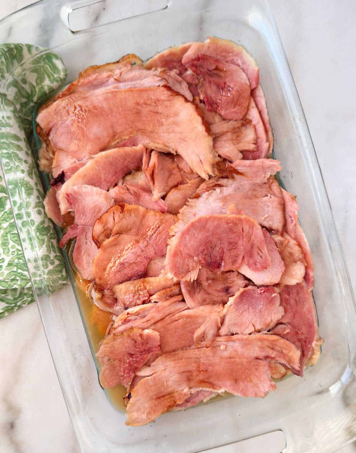 baked ham slices with brown sugar in baking dish.