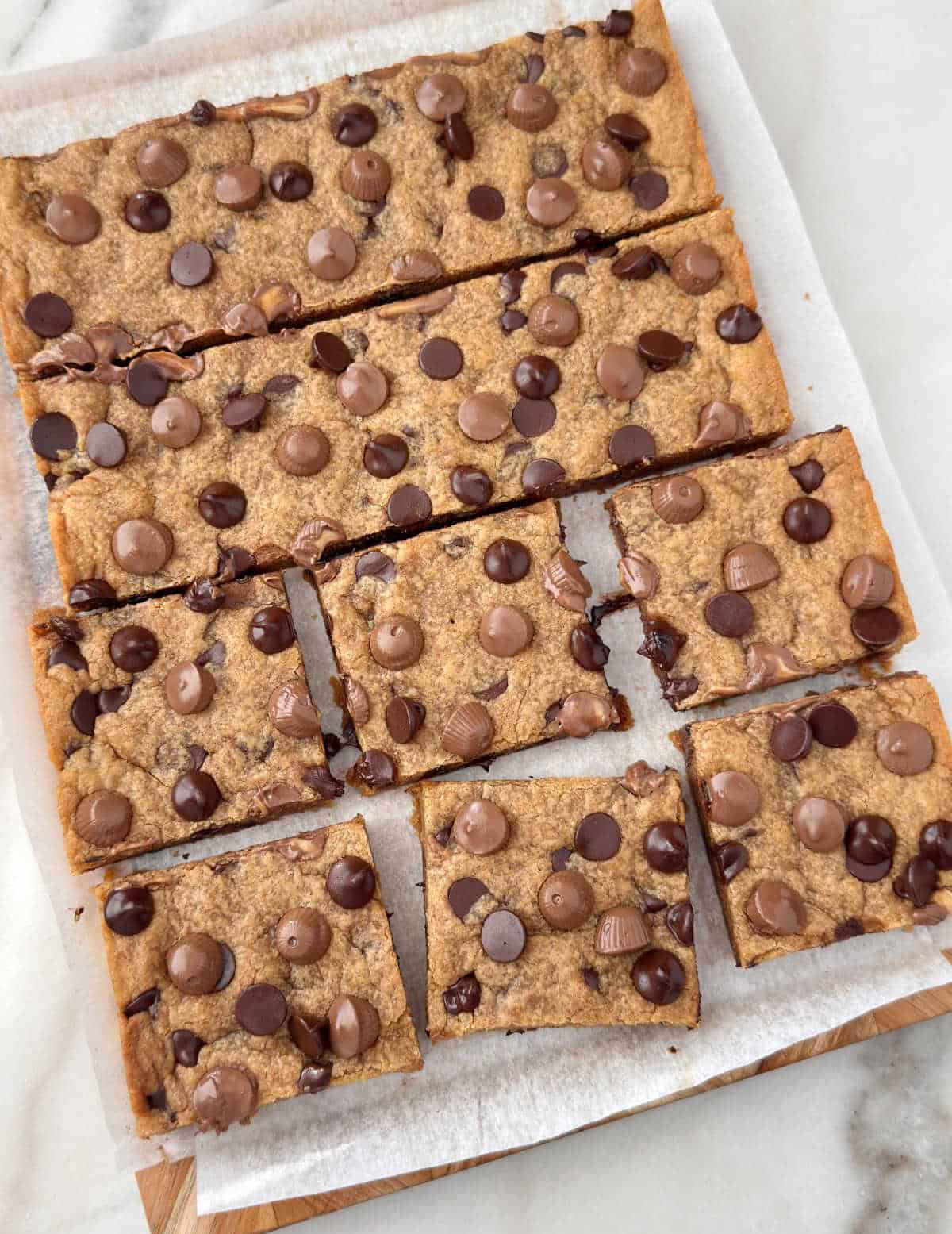 peanut butter chocolate chip cookie bars cut into squares.