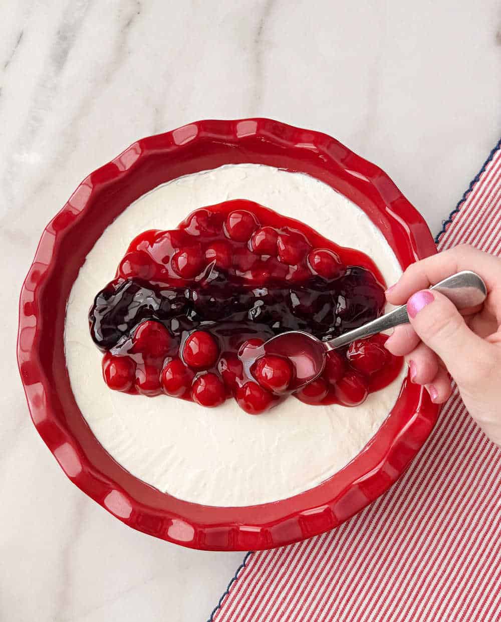 spooning pie filling on top.