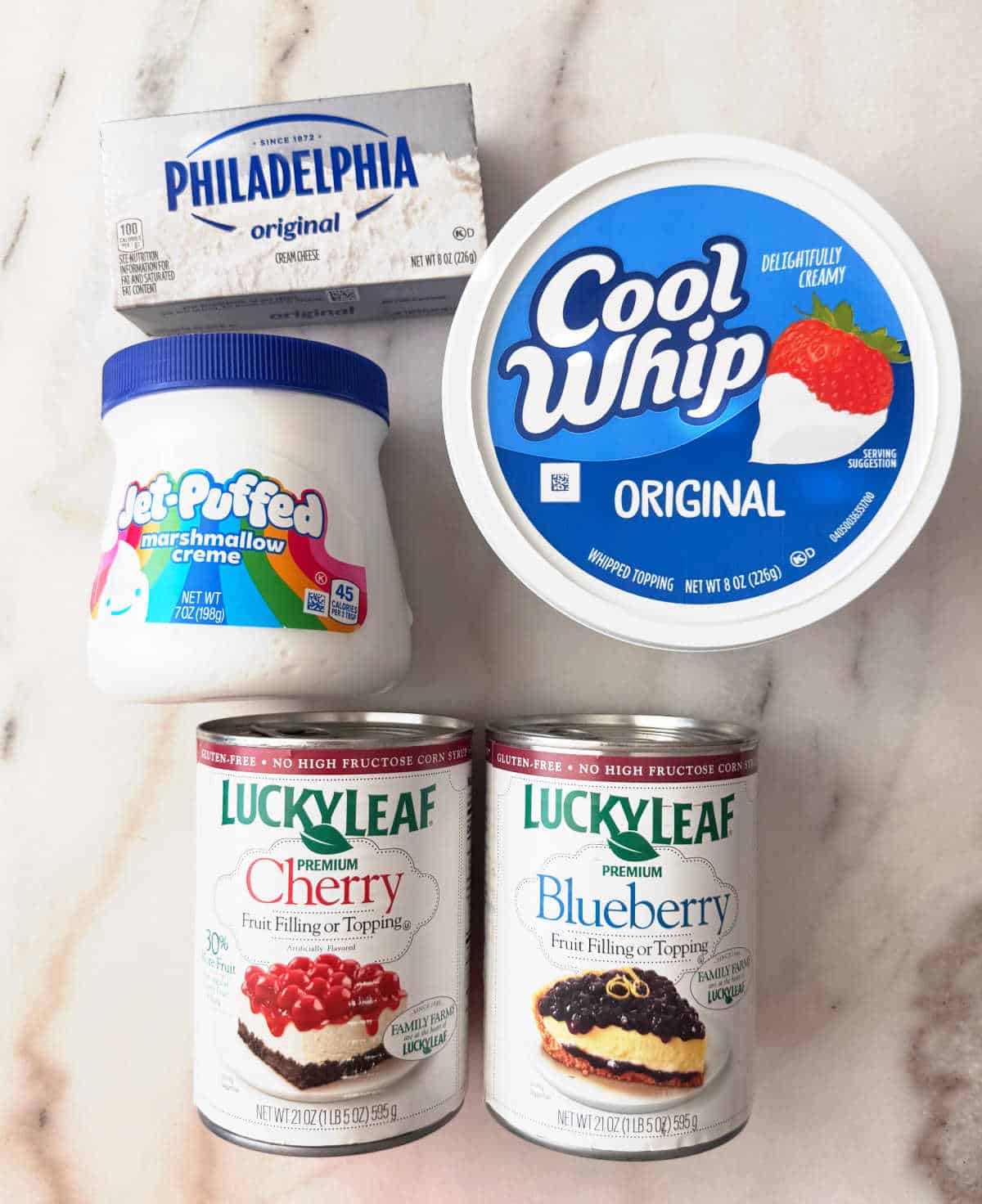 cans of pie filling, cool whip, marshmallow fluff and cream cheese.