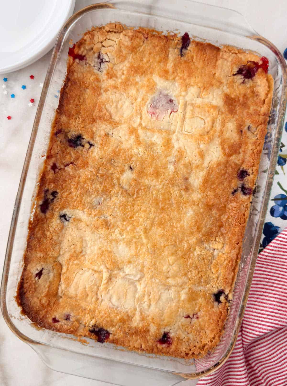 red white and blue dump cake in baking pan on the table.