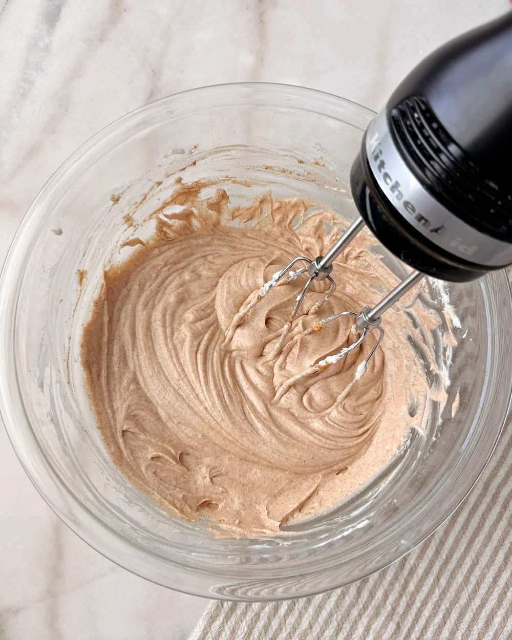 mixing in cinnamon.