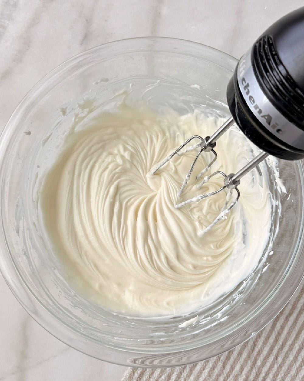 mixing dip with electric mixer.