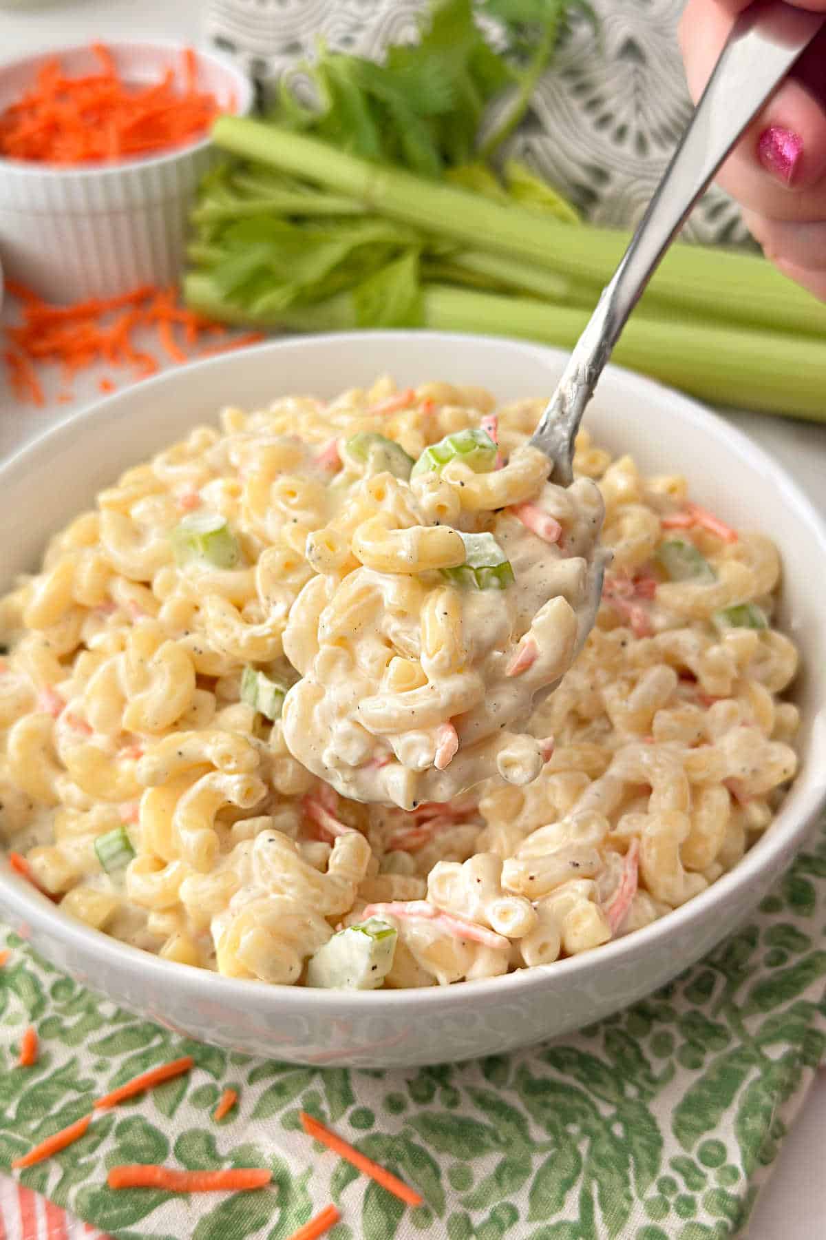 Hawaiian mac salad on a serving spoon.