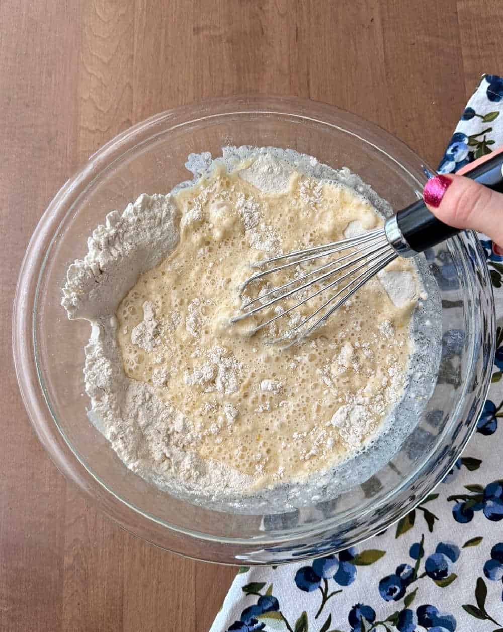 whisking batter in mixing bowl.