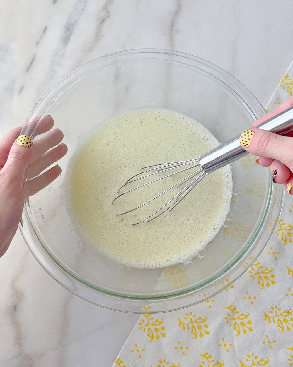 whisking gelatin and water in mixing bowl.