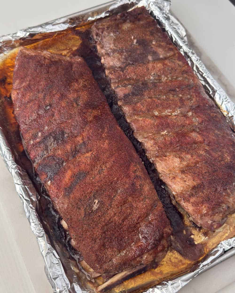 baked st louis pork ribs on baking sheet.