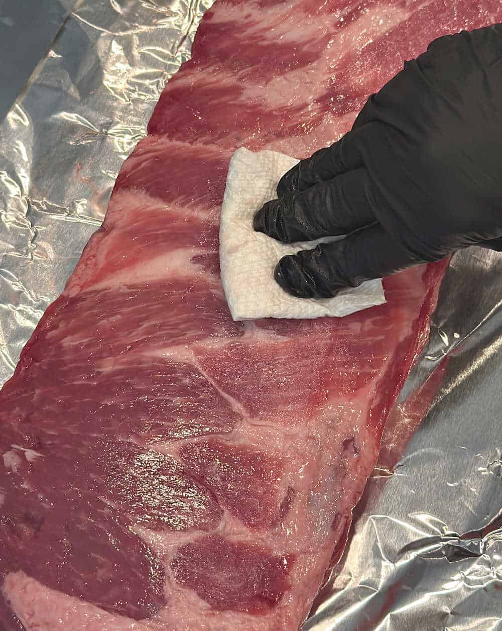 patting ribs dry with paper towel.