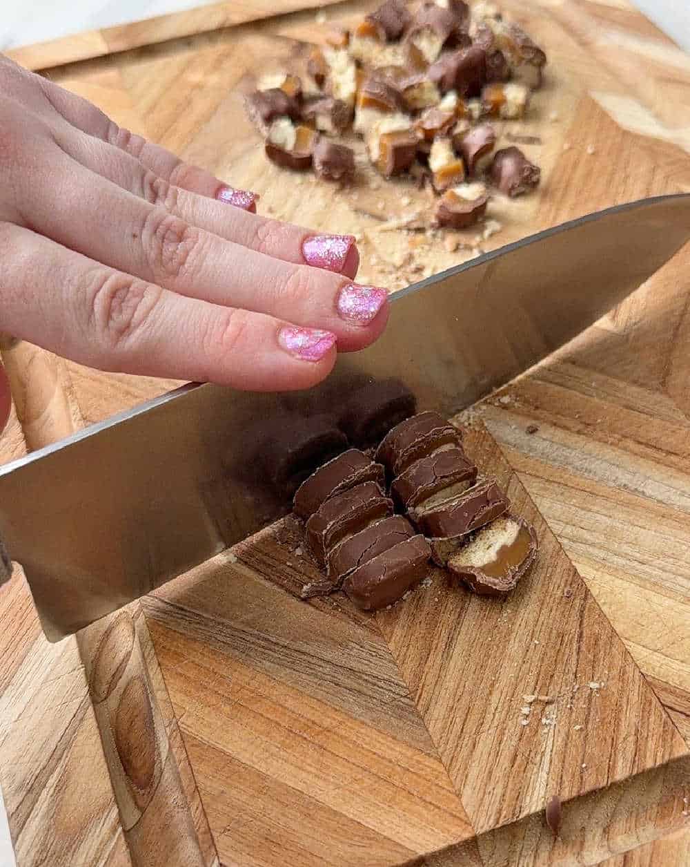 chopping candy on cutting board.