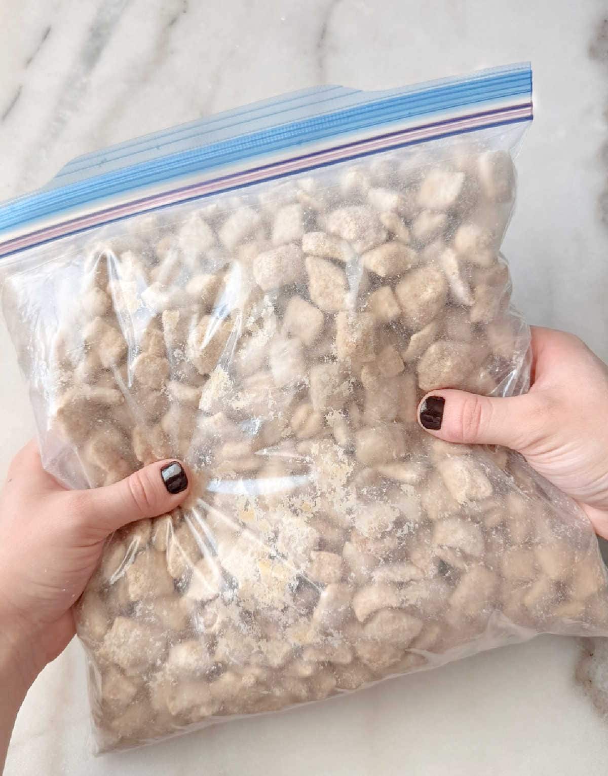 shaking muddy buddies in freezer bag.
