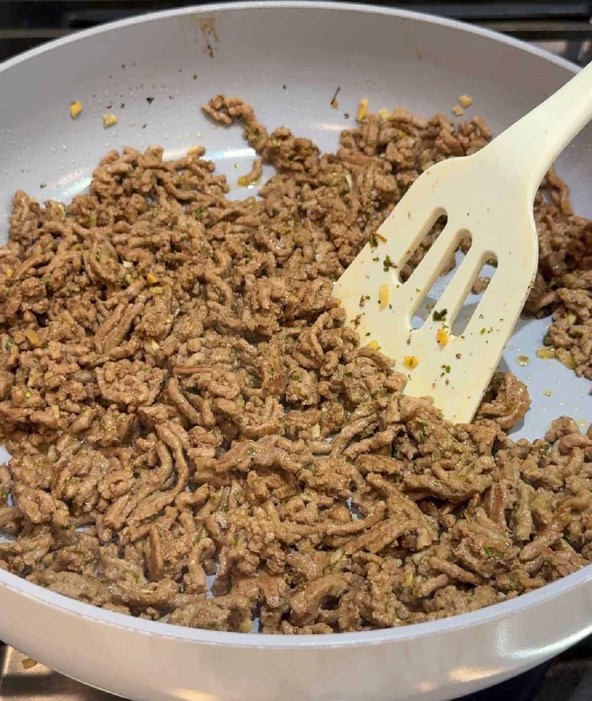 browning ground meat in skillet.