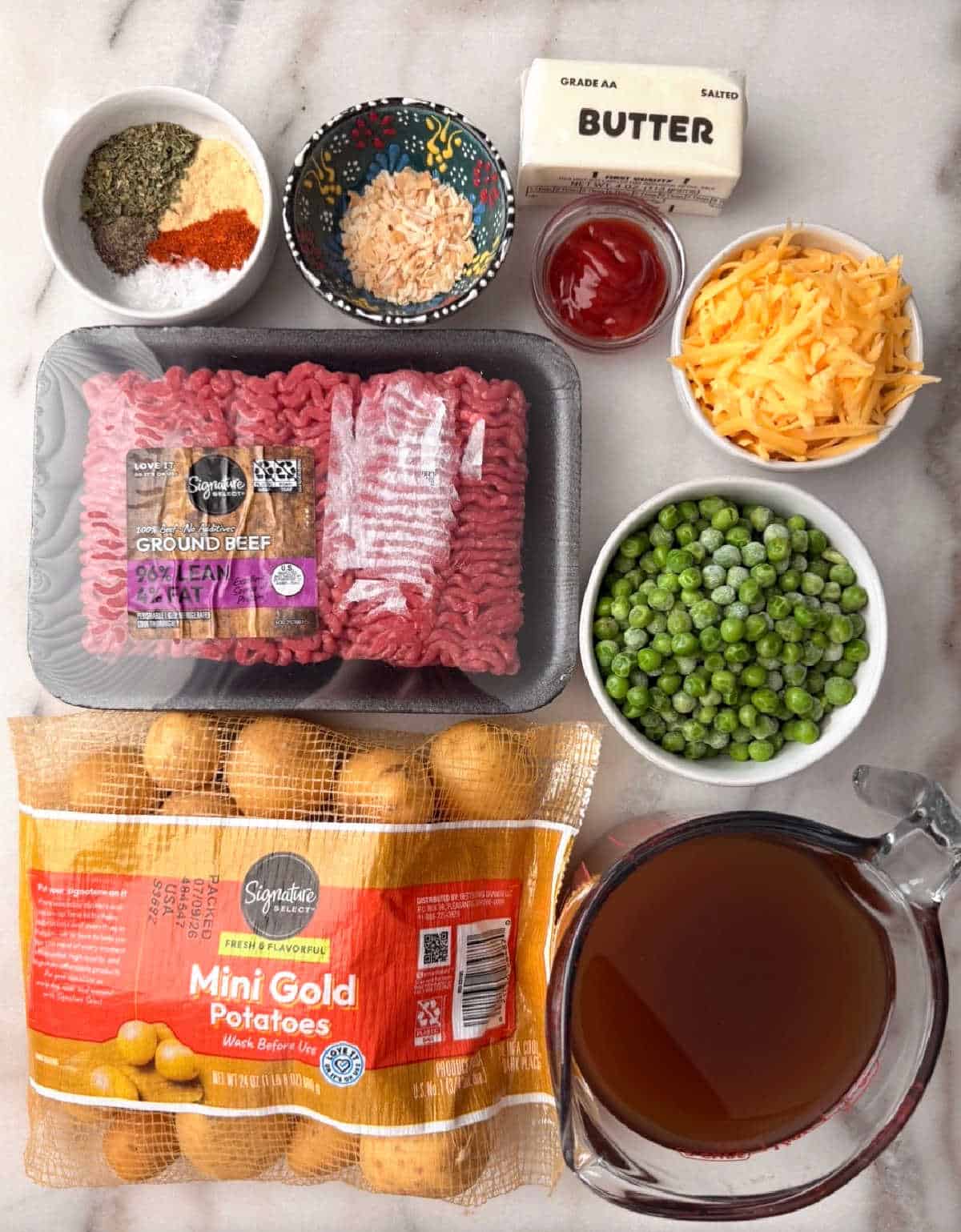 ground beef, mini potatoes, peas, butter, broth, ketchup, spices.