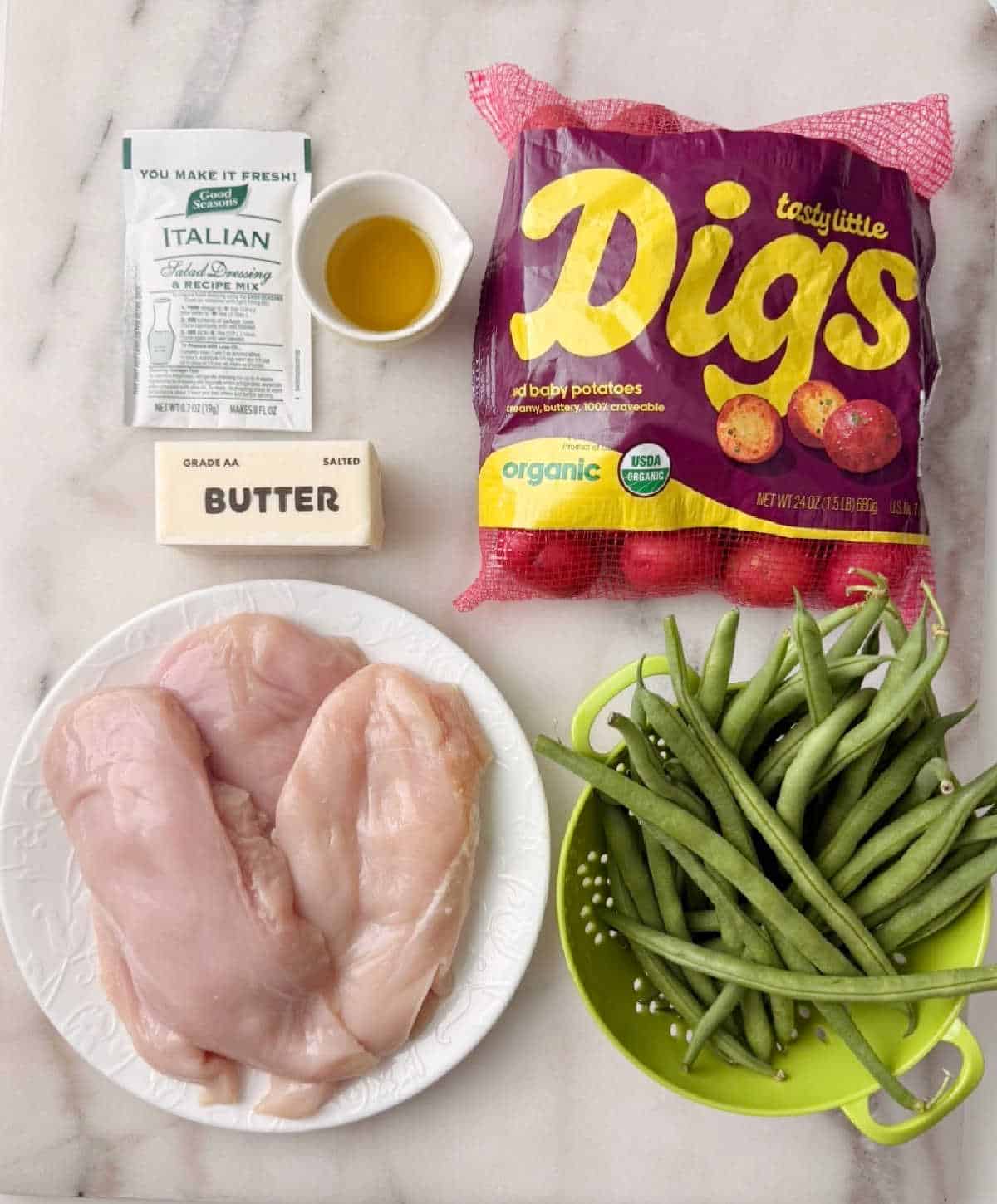 baby red potatoes, green beans, chicken breast, butter, oil, dressing mix.
