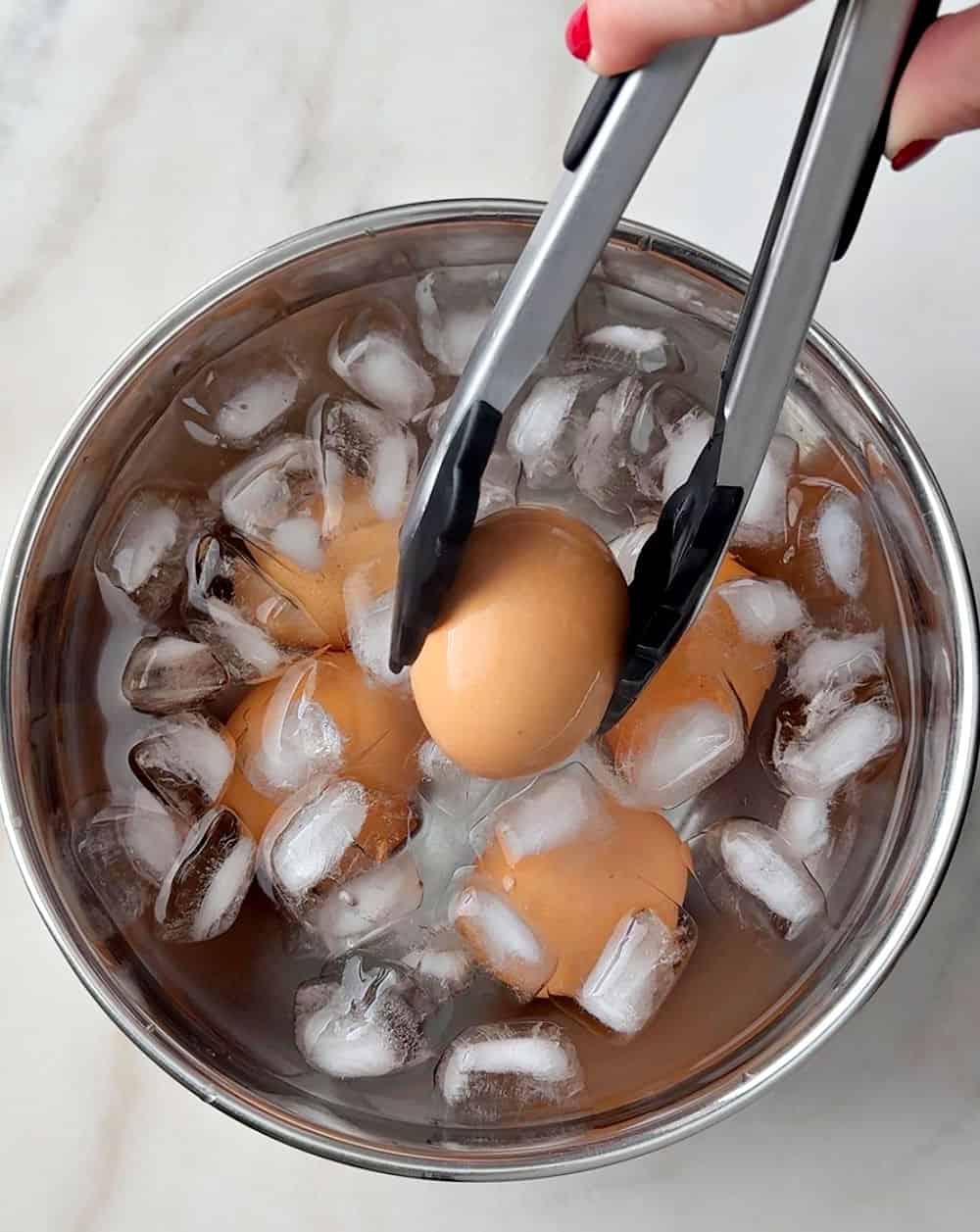 placing eggs in ice water.