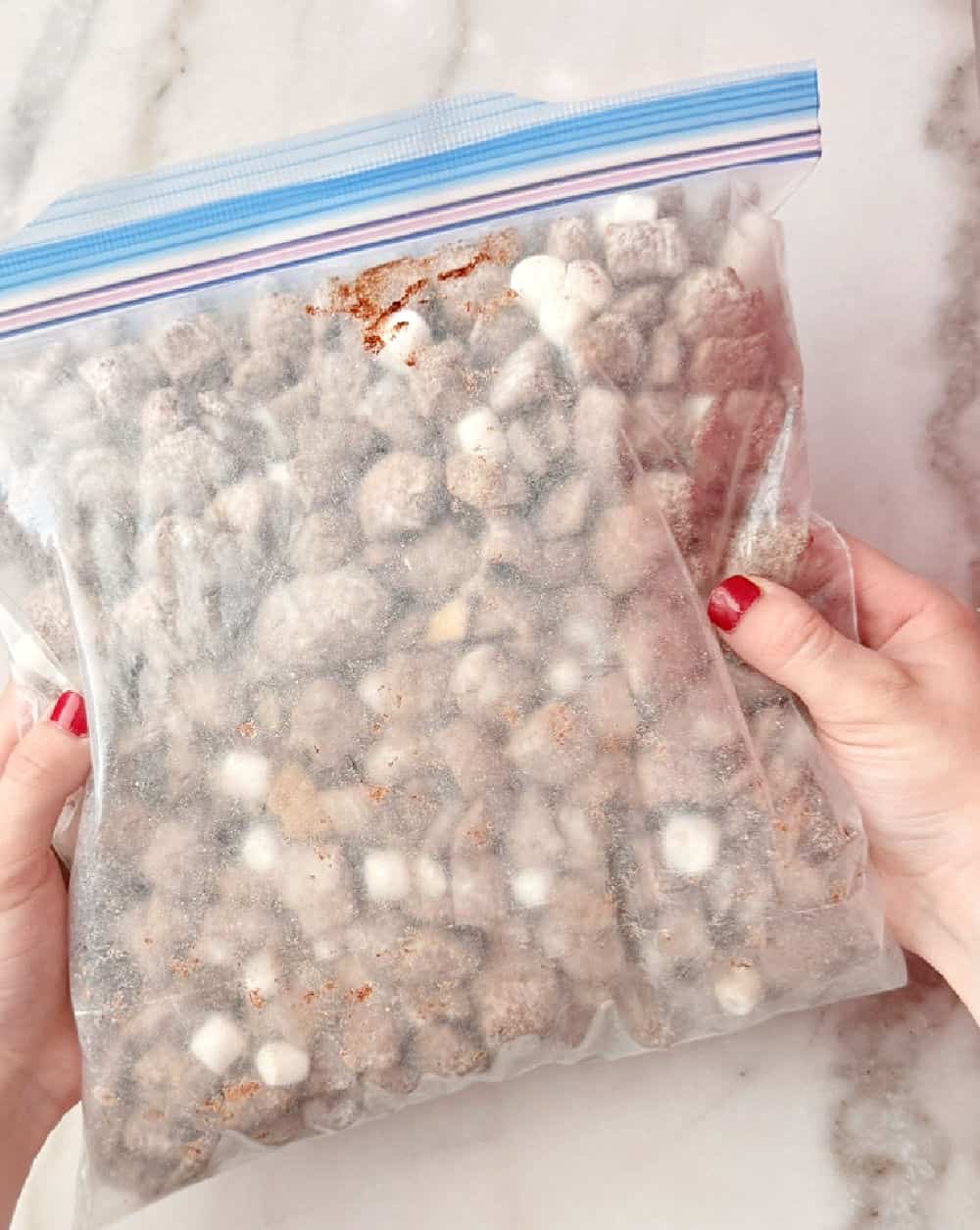 shaking muddy buddies in freezer bag.