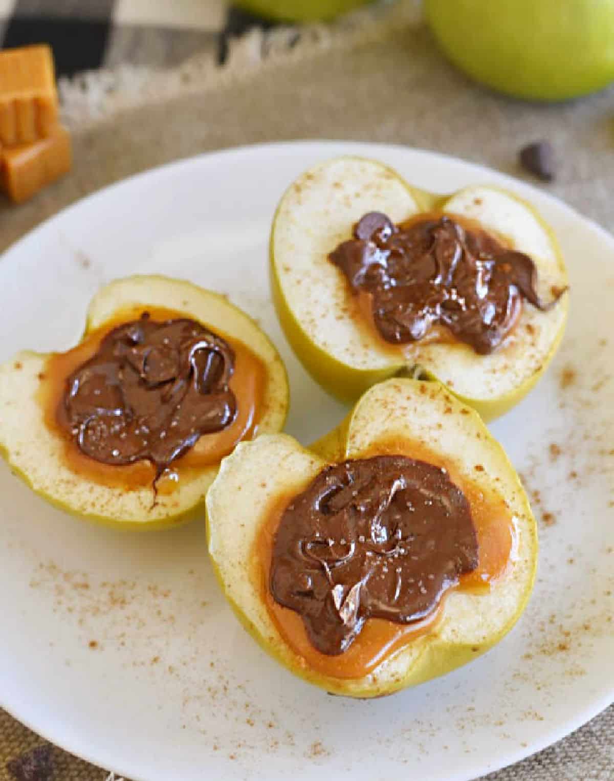 plate of baked apples stuffed with caramel.